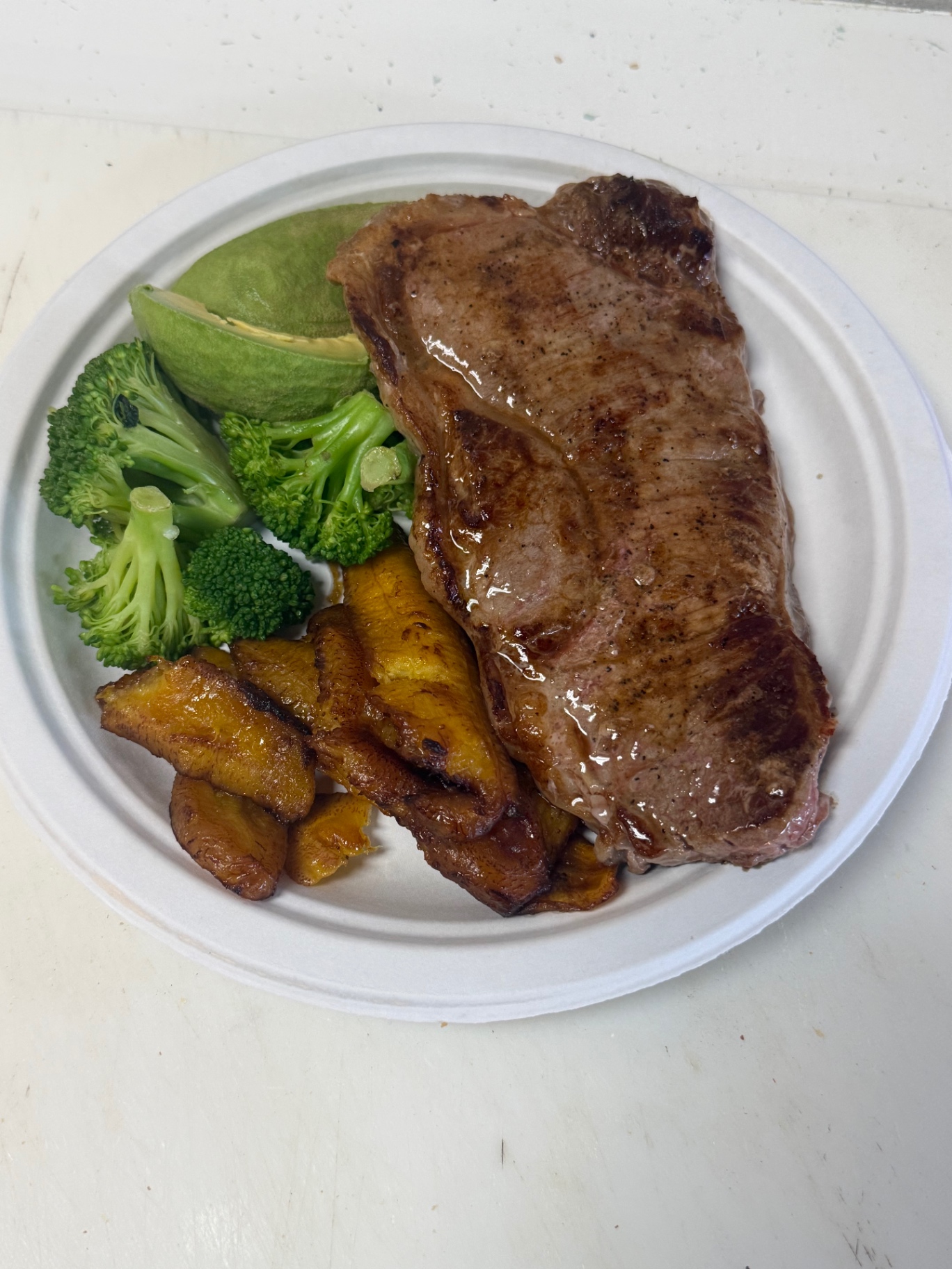 Grilled steak plate with plantains, broccoli & avocado