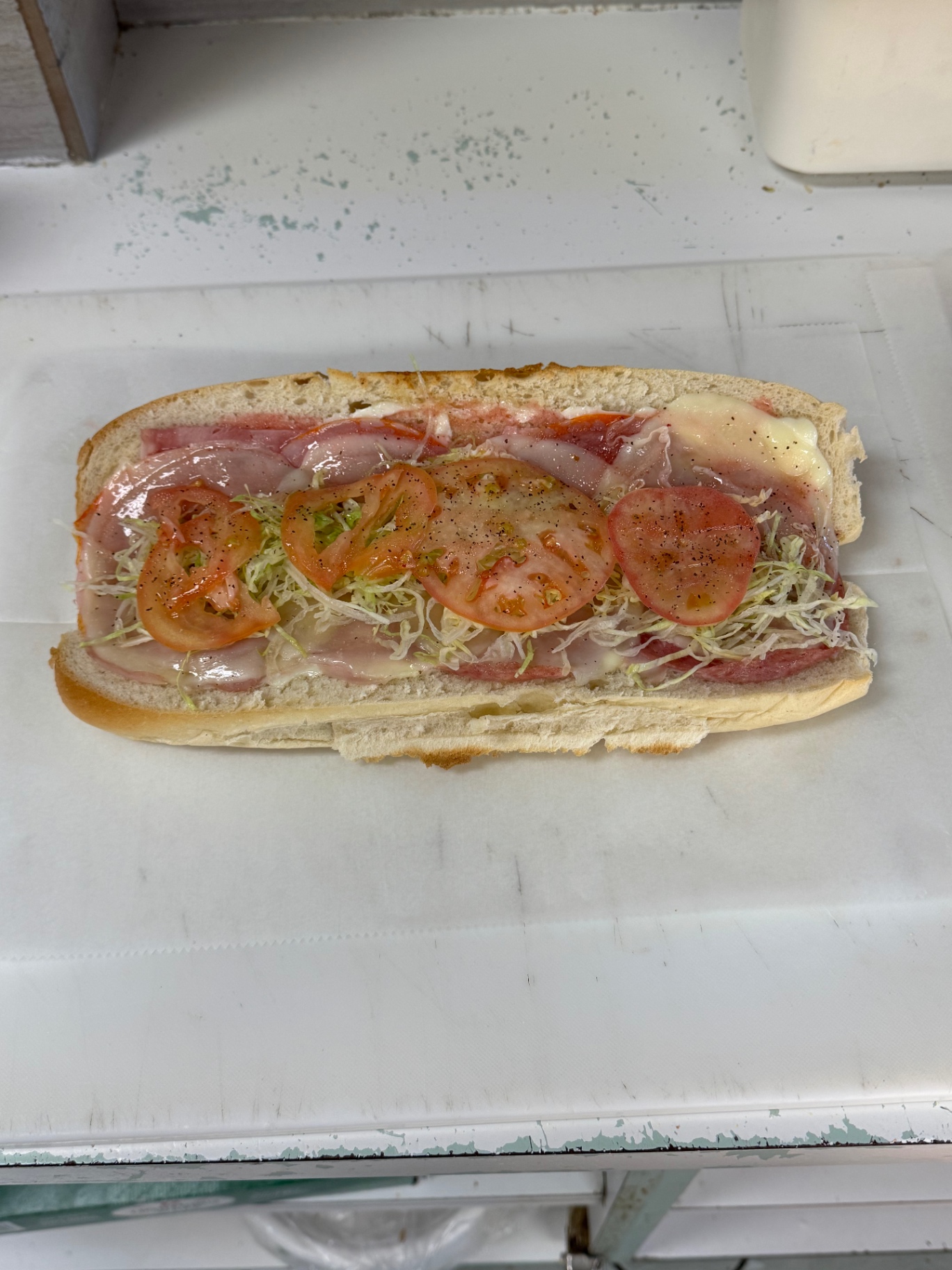 Open-faced Italian sub with fresh ingredients